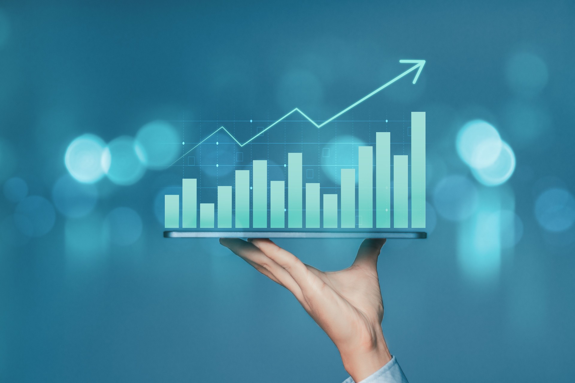 Businessman holding smartphone with business chart growth graph and and increase of chart positive indicators business. Analysis of investment strategies and economic trends.