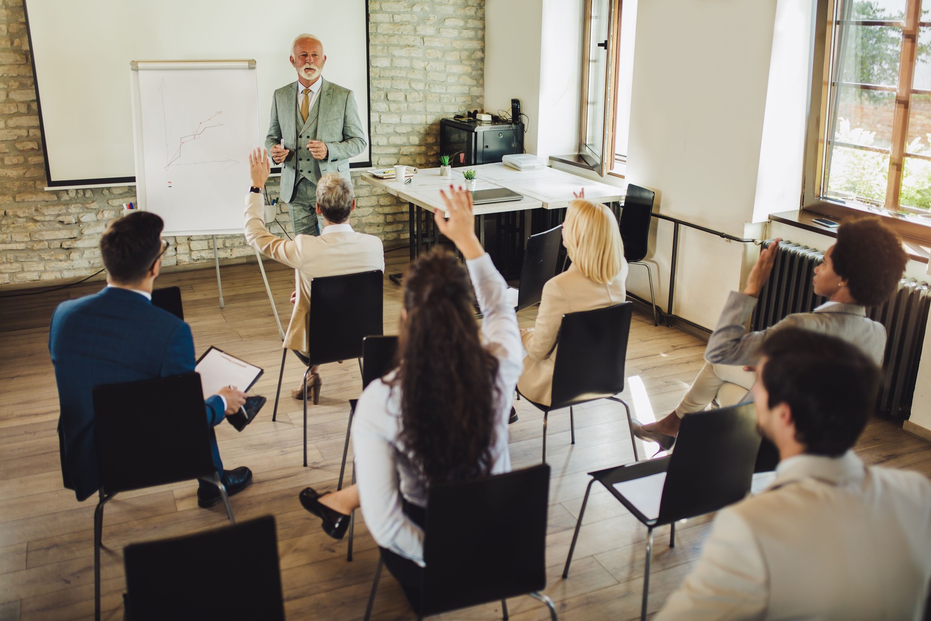 Speaker at business workshop and presentation. Audience at the conference room.